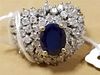 14K RING W/SAPPHIRE CENTER SURROUNDED BY DIAMONDS