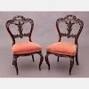 A Pair of Victorian Elaborately Carved Rosewood Side Chairs, 19th Century.