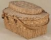 Unusual Algonquian Native American picnic basket, ca. 1900, with swing handles, 11'' h., 19'' w.