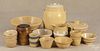 Sixteen pieces of yelloware, ca. 1900, to include five bowls, eight custard cups, a pitcher, a crock