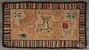 Hooked rug with a stag flanked by trees and flowers, 19th c., 40'' x 22 1/2''.
