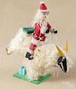 Carved and painted outsider art figure of Santa Claus riding a sheep, unsigned, 16 1/2'' h.