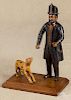 Contemporary carved and painted fireman and his dog, 10'' h.
