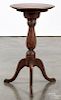 Chippendale style walnut candlestand, 20th c., with a revolving top, 27'' h., 14'' dia.