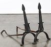 Pair of arts and crafts wrought iron andirons, early 20th c., 22'' h.
