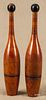 Pair of wooden Indian clubs, ca. 1900, with remnants of a red wash, 14 1/2'' h.