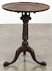 Chippendale style mahogany candlestand, early 20th c., the top with an inlaid panel