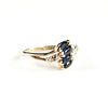 A 10K YELLOW GOLD, DIAMOND, AND SAPPHIRE BYPASS PINKY RING, 20TH CENTURY,