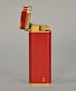 Cartier Chinese red enameled "Trinity" lighter.