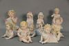 Group of nine porcelain and bisque baby and child figures. ht. 5 1/2" to 12 1/2"
