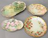 Four hand painted Limoges trays with flowers and strawberries, two signed and dated. lg. 11" to 16".