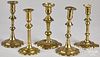 Five English Queen Anne brass candlesticks