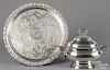 Silver-plated tureen, 12'' l., 15 1/2'' w., and platter, 22'' dia.