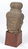 Carved sandstone Buddha head, 8'' h.