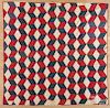 Red, white, and blue tumbling block quilt, late 19th c., 75'' x 76''.