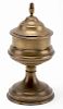 Snuff Vase. French, ca. 1900. Spun brass vase transforms one objects into another when the lid is clamped on and removed. 5 _Ó high. Minor tarnish, l