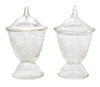 * A Pair of Engraved Glass Covered Jars Height 7 1/2 inches.