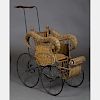 A Victorian Wicker and Metal Doll's Stroller, 19th/20th Century.
