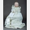 A German 14in. Bisque Head Baby Doll, 19th/20th Century,