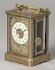 Brass carriage clock with a cast floral bezel, 5 1/2'' h.