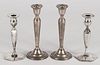 Two pairs of weighted sterling silver candlesticks, 7 1/2'' h. and 9'' h.