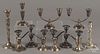 Twelve sterling silver weighted candlesticks and candelabra, tallest - 10 1/4''.