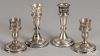 Two pairs of weighted sterling silver candlesticks, 4 3/4'' h. and 6 1/2'' h.