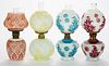 ASSORTED PATTERN STAINED OPAQUE GLASS MINIATURE LAMPS, LOT OF FOUR,