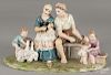 Italian hand painted porcelain figural group of a family, signed Ganci (Italie, 10 1/2'' h., 18'' l.