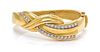 * An 18 Karat Yellow Gold and Diamond Bangle Bracelet, 36.60 dwts.