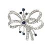 A White Gold, Sapphire and Diamond Bow Pendant/Brooch, 6.80 dwts.