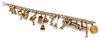 A 14 Karat Yellow Gold Charm Bracelet with 15 Attached Charms, 26.00 dwts