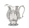 * An American Silver Water Pitcher, Gorham Mfg. Co., Providence, RI, 1904, of oval panelled baluster form, embossed and chased w