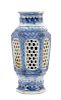 A Chinese Blue and White Porcelain Hexagonal Vase Height 8 3/4 inches. 青花鏤雕六邊形瓶，18世纪，高8.75英吋