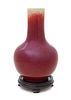 A Sang-de-Boeuf Glazed Porcelain Bottle Vase Height 12 1/2 inches. 祭紅釉長頸瓶，高12.5英吋