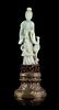 A Celadon Jade Figure of Guanyin Height of figure 9 3/4 inches. 青玉雕觀音立像， 19/20世紀，高9.75英吋