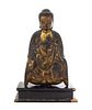 A Gilt and Black Lacquered Wood Figure of a Seated Shakyamuni Buddha Height of figure 12 1/4 inches. 金漆木雕釋迦牟尼佛坐像，高12.25英