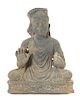 * A Gandharan Schist Figure of a Seated Buddha Height 18 1/2 inches.