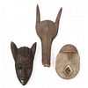 Two West African Carved Wooden Masks and a Headdress