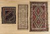 Three Oriental throw rugs, early 20th c., largest - 5'6'' x 3'3''.