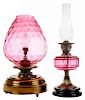 Two British Cranberry Glass Oil Lamps