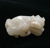 AN ANTIQUE CARVED WHITE JADE LIONS, QING DYNASTY