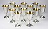 Set of 12 Wallace sterling water goblets with vermeil gold wash interior. Hallmarked R. Wallace & Sons, Sterling, 12. 6ﾽ"h. 3ﾾ"diam. Approx 72 tro