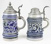 two early 20th c German blue & white steins, ht 8.5”, 10”