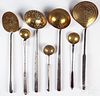 Seven wrought iron and brass long handled utensils