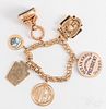 14K gold charm bracelet, with 14K and 10K charms.