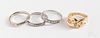 Three 18K gold rings and a platinum ring