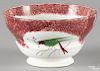 Red spatter waste bowl with a parrot, 3 1/8'' h., 5 5/8'' dia.
