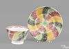 Red, green, yellow, and black rainbow spatter swirl pattern cup and saucer, 19th c.