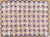 Pennsylvania patchwork double wedding ring crib quilt, early 20th c., with a scalloped border